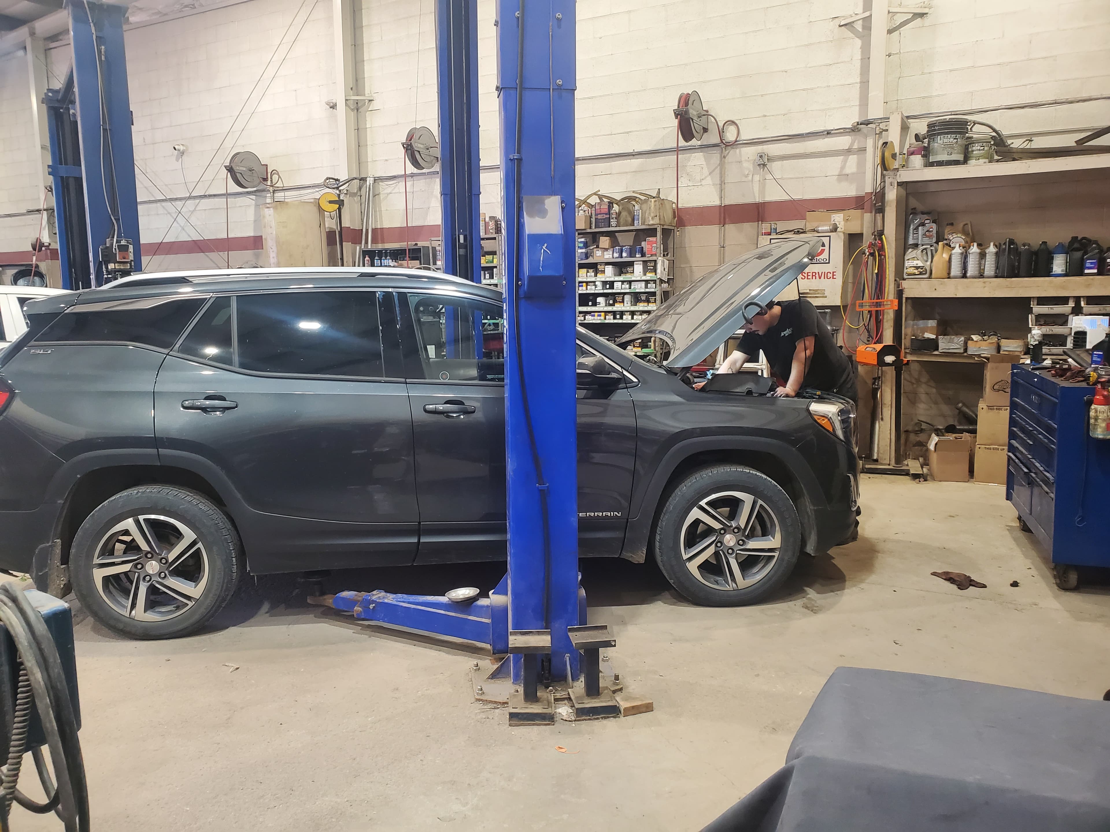 Cody working on a car